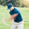 Golfer mid-swing
