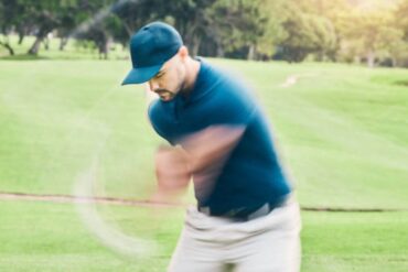 Golfer mid-swing